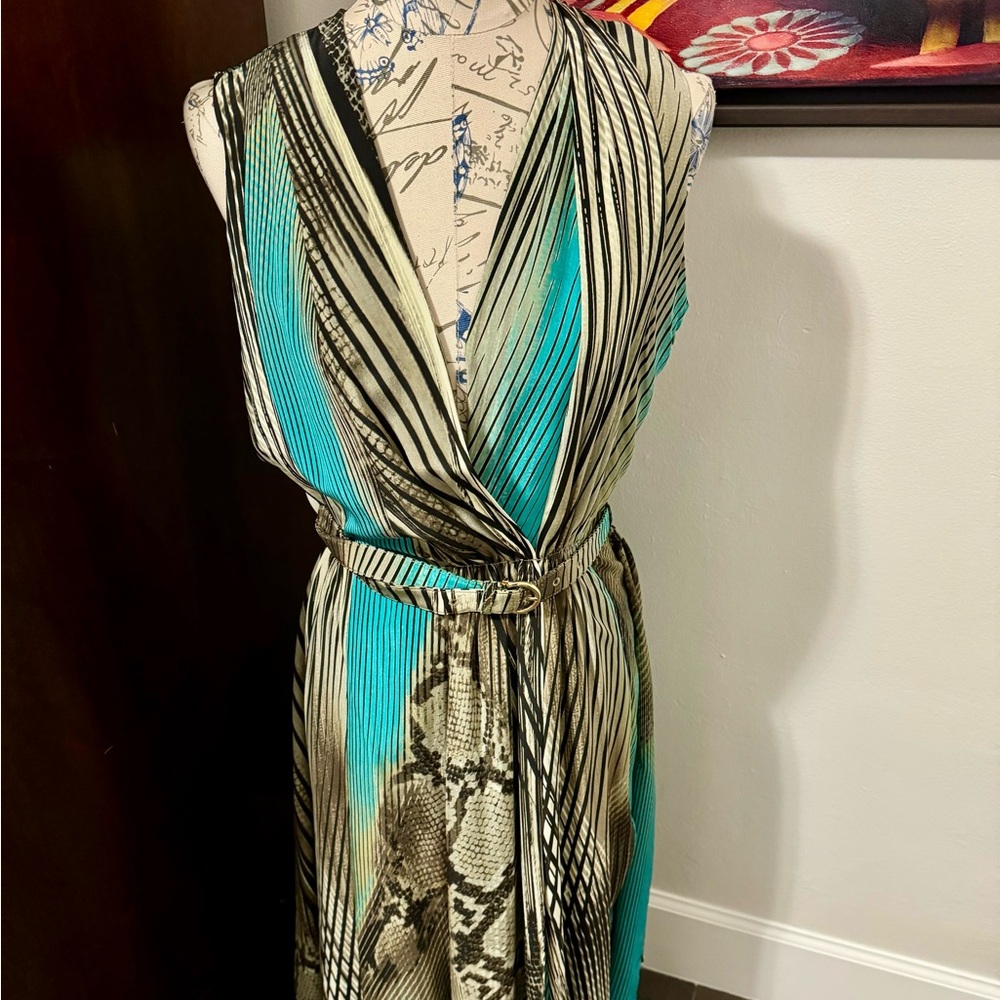 SALVATORE FERRAGAMO 100% silk V-neck animal print dress with matching belt.
